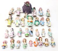 Collection thirty of ceramic pin cushion/ half dolls of varying sizes,