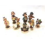 Eight Goebel figures including Brother Boy no. 95, Sister no.