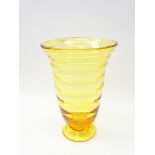 Amber glass Whitefriars style footed vase with ribbed body,