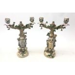 Pair of 19th century Ernst Bohne Söhne porcelain candelabra modelled as Owls perched on a tree,