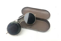 Pair of wire framed aviation pilots glare glasses with the original Air Ministry tin,