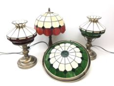 Pair brushed metal table lamps with Tiffany style red and green shades,