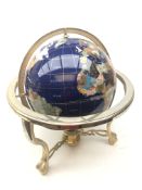 Polished stone inlaid terrestrial globe on brass finish stand,