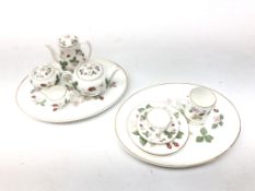 Wedgwood miniature 'Wild Strawberry' pattern tea set comprising two trays, coffee pot, teapot, trio,