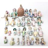 Collection thirty of ceramic pin cushion/ half dolls of varying sizes,