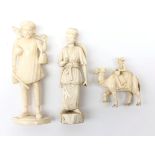 19th/ early 20th century matched pair Indian ivory figures and a similar age ivory carving of a