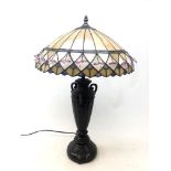 Tiffany style table lamp on urn shaped base with leaded glass and beaded shade,