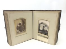 Victorian photograph album, leather bound with gilt initials and edges and brass clasp,