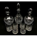 Cut glass table ware comprising a pair of mallet form decanters, one with replacement stopper,