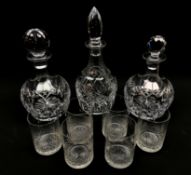 Cut glass table ware comprising a pair of mallet form decanters, one with replacement stopper,