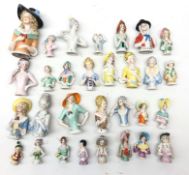 Collection of thirty ceramic pin cushion/ half dolls of varying size H11cm max Condition