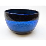 Blue art glass bowl with faceted honeycomb style band,