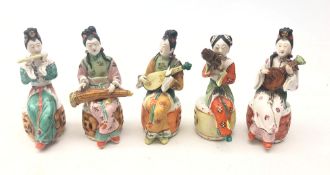 Set of five early 20th century Chinese ceramic musicians, each polychrome decorated,