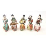 Set of five early 20th century Chinese ceramic musicians, each polychrome decorated,