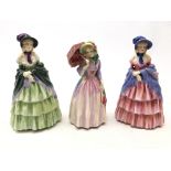 Three Royal Doulton figures 'A Victorian Lady' HN 728 and HN 1452 and Miss Demure HN 1402 (3)
