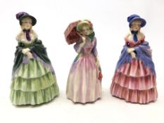 Three Royal Doulton figures 'A Victorian Lady' HN 728 and HN 1452 and Miss Demure HN 1402 (3)