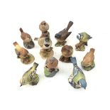 Eleven Royal Worcester, Beswick, Royal Adderley and other matt glazed birds including a Crested Tit,