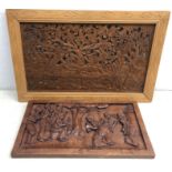 20th century African wooden panel depicting figures dancing and a similar panel on fretwork ground,