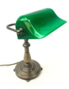 Banker style desk lamp with green glass shade and brushed bronze finish base,