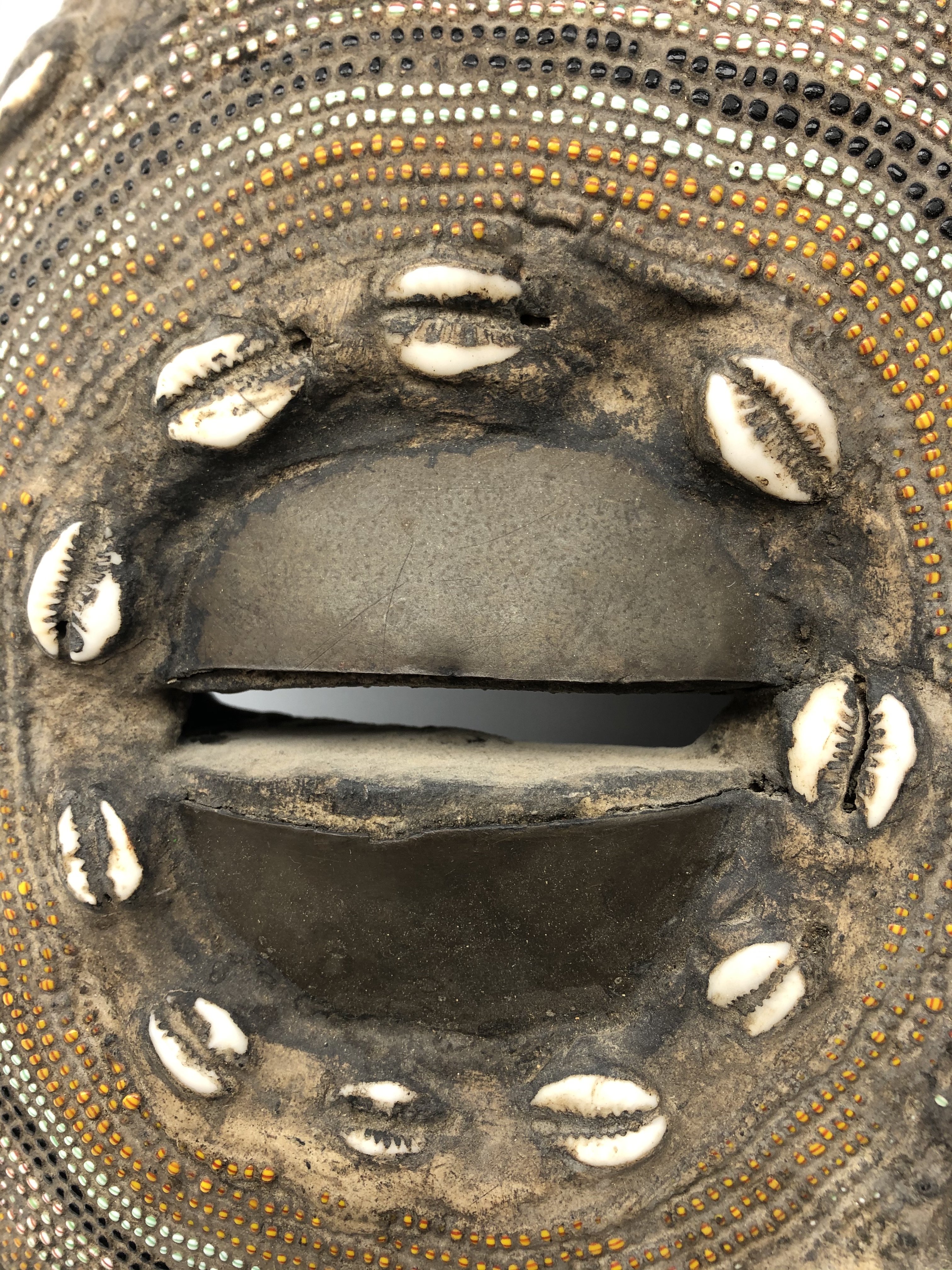 African carved softwood mask with eyes, nose and mouth apertures, inlaid cowrie shells, - Image 3 of 4