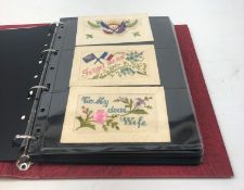 Modern loose leaf album containing over fifty WW1 silk postcards including flags of the Allies,