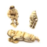 Two Japanese Meiji ivory Netsuke in the form of a figure with staff and dancing figure & ivory