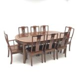 Chinese hardwood extending dining table with two leaves, pierced apron,