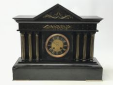 Victorian polished black slate mantel clock, Temple shaped case with brass frieze and columns,