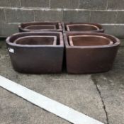 Four large 'D' shaped rustic frost proof pots (W51cm, H33cm, D61cm),
