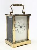Early 20th carriage timepiece with white enamel Roman dial and bevelled glass panels,