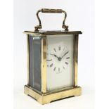 Early 20th carriage timepiece with white enamel Roman dial and bevelled glass panels,