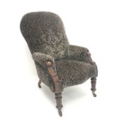 Late Victorian high spoon back mahogany framed upholstered armchair, turned supports,