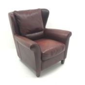 Natuzzi wingback style armchair, upholstered in maroon leather,