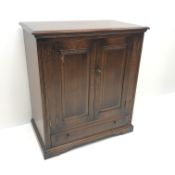 Traditional oak side cabinet, two cupboards above single drawer, shaped plinth base,