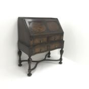 Early 20th century oak bureau, retracting fall front enclosing fitted interior above two drawers,