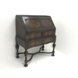 Early 20th century oak bureau, retracting fall front enclosing fitted interior above two drawers,