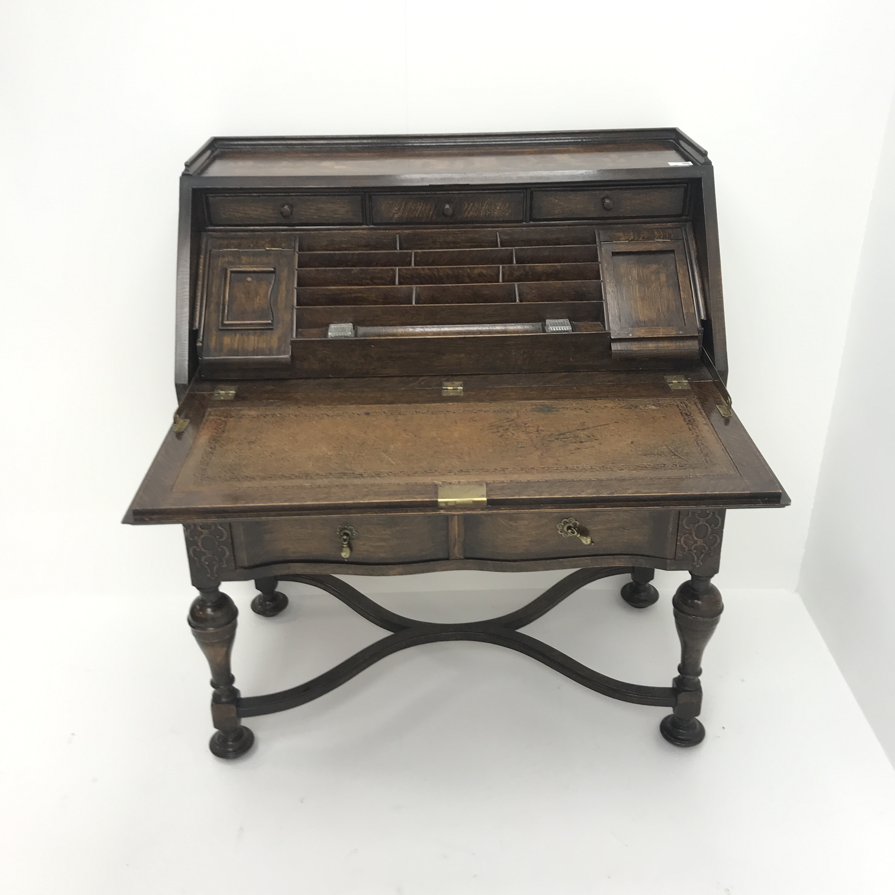 Early 20th century oak bureau, retracting fall front enclosing fitted interior above two drawers, - Image 3 of 5