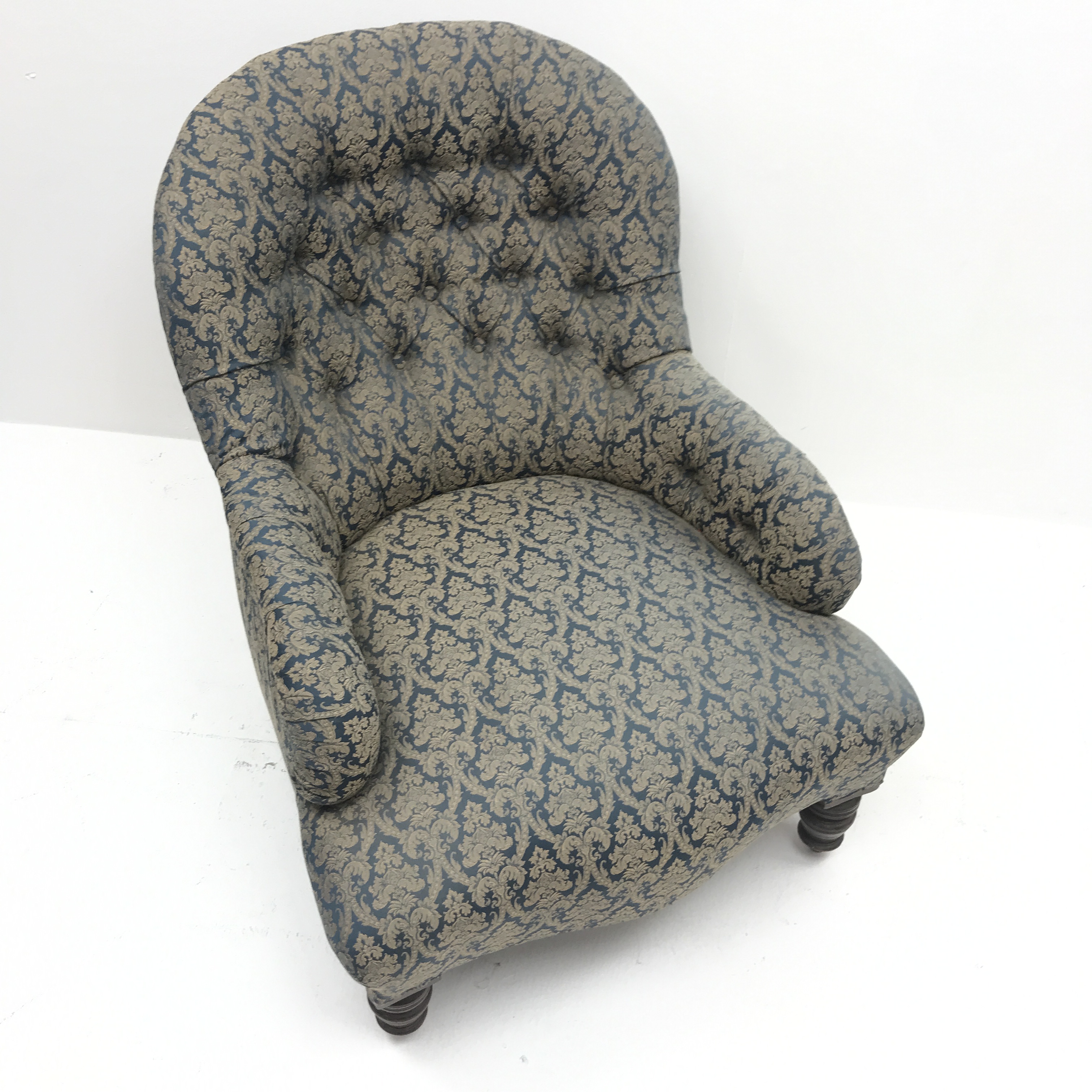 Victorian spoon back armchair, upholstered in a deep buttoned patterned fabric, turned supports, - Image 2 of 3