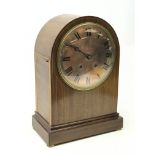 Large Edwardian inlaid mahogany arched top bracket clock with silvered Roman dial,