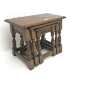Medium oak nest of three tables, turned supports joined by stretchers, W60cm, H45cm,