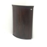 Georgian mahogany bow front corner cupboard, two doors enclosing three shelves, W71cm, H103cm,