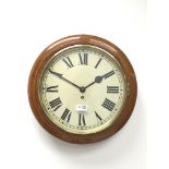 Early 20th century oak framed wall clock, circular Roman dial with brass bezel,