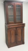Victorian mahogany bookcase on cupboard, two lead glazed doors, single frieze drawer,