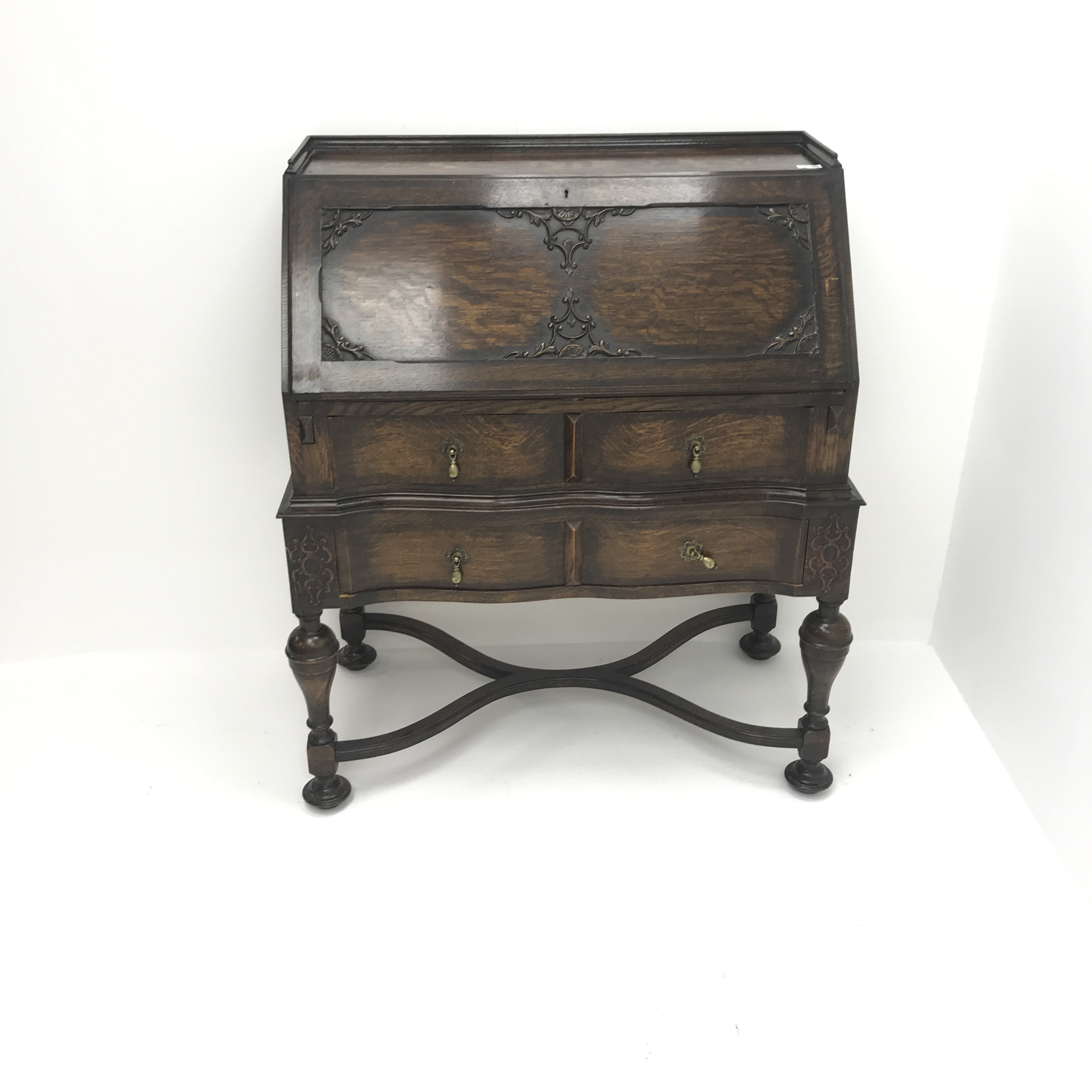 Early 20th century oak bureau, retracting fall front enclosing fitted interior above two drawers, - Image 2 of 5