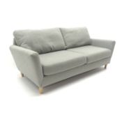 Contemporary three seat sofa upholstered in grey fabric,