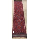 Meshwani red ground runner, geometric patterned field, repeating border,