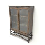 Early 20th century oak bookcase, two lead glazed doors enclosing two shelves,