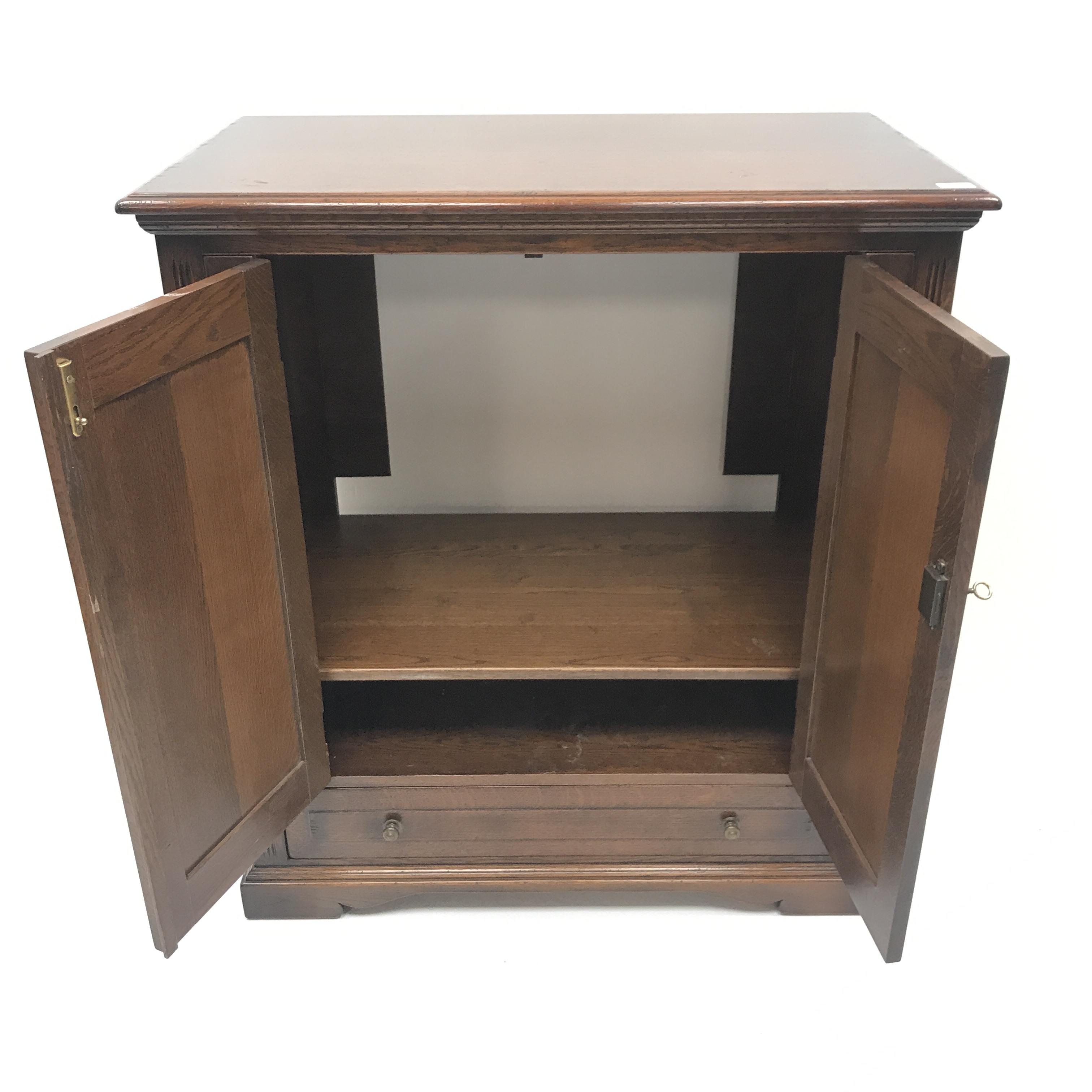 Traditional oak side cabinet, two cupboards above single drawer, shaped plinth base, - Image 3 of 3