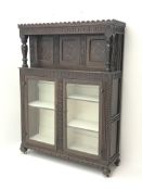 Early 20th century carved and inlaid oak court display cabinet,