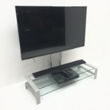 Panasonic TX-49ES400B (49") television on stand with sound bar and Samsung receiver